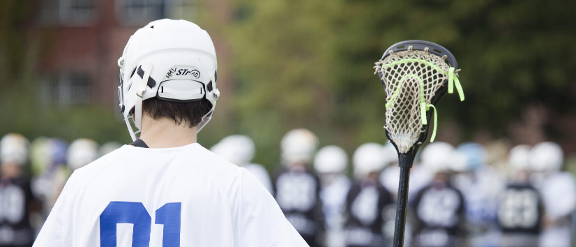 Teen playing lacrosse